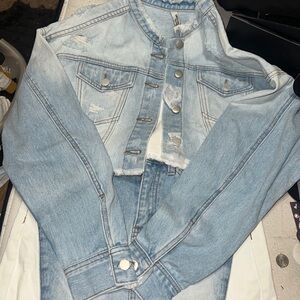 This is a light blue denim skirt set